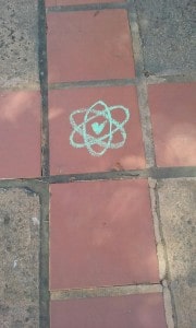 Atomic Green Love: Similar symbols decorated sidewalk in multiple locations